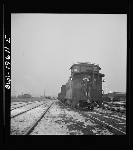 Fort Madison, Iowa. A freight train leaving the Atchison, Topeka, and Santa Fe Railroad yard for the west coast
