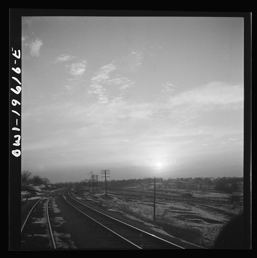 Untitled photo, possibly related to: Iowa countryside along the Atchison, Topeka, and Santa Fe Railroad yard between Fort Madison, Iowa and Marceline, Missouri