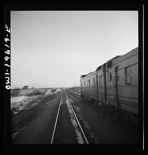 Untitled photo, possibly related to: Baring, Missouri. A train stopping for coal and water along the Atchison, Topeka, and Santa Fe Railroad between Fort Madison, Iowa and Marceline, Missouri