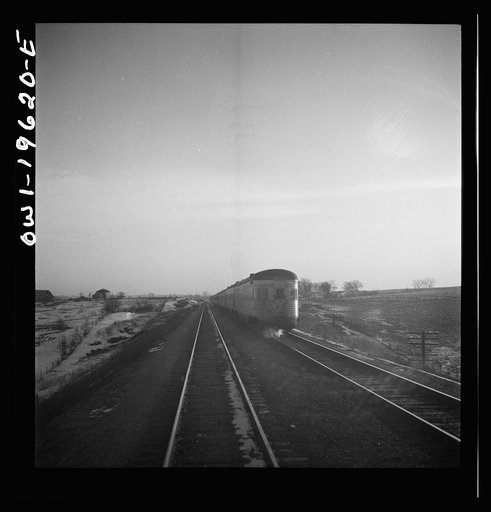 Untitled photo, possibly related to: Baring, Missouri. A train stopping for coal and water along the Atchison, Topeka, and Santa Fe Railroad between Fort Madison, Iowa and Marceline, Missouri
