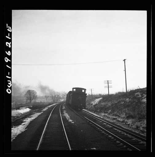 Untitled photo, possibly related to: Baring, Missouri. A train stopping for coal and water along the Atchison, Topeka, and Santa Fe Railroad between Fort Madison, Iowa and Marceline, Missouri