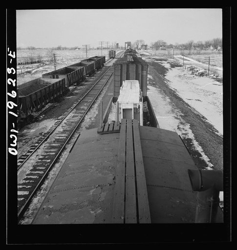Baring, Missouri. A train stopping for coal and water along the Atchison, Topeka, and Santa Fe Railroad between Fort Madison, Iowa and Marceline, Missouri