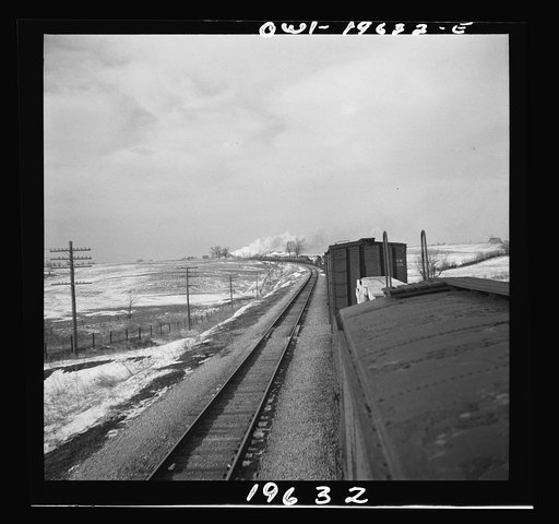 Untitled photo, possibly related to: Baring, Missouri. A train stopping for coal and water along the Atchison, Topeka, and Santa Fe Railroad between Fort Madison, Iowa and Marceline, Missouri