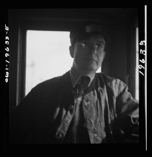 Untitled photo, possibly related to: Conductor J. S. Durham, of Fort Madison, Iowa, has been with the Atchison, Topeka, and Santa Fe Railroad for twenty-six years. He started with the New York central railroad at Toledo, Ohio in 1917