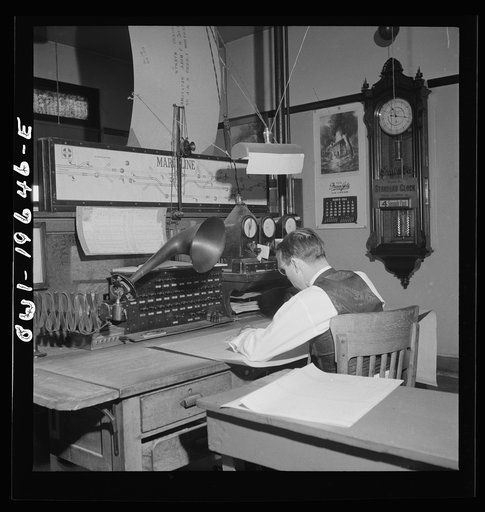 Untitled photo, possibly related to: Marceline, Missouri. A dispatcher at work in the Atchison, Topeka, and Santa Fe Railroad offices