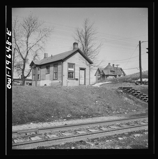 Marceline, Missouri. The switchmen's shanty at the Atchison, Topeka, and Santa Fe Railroad yard. Note the three service stars in the window