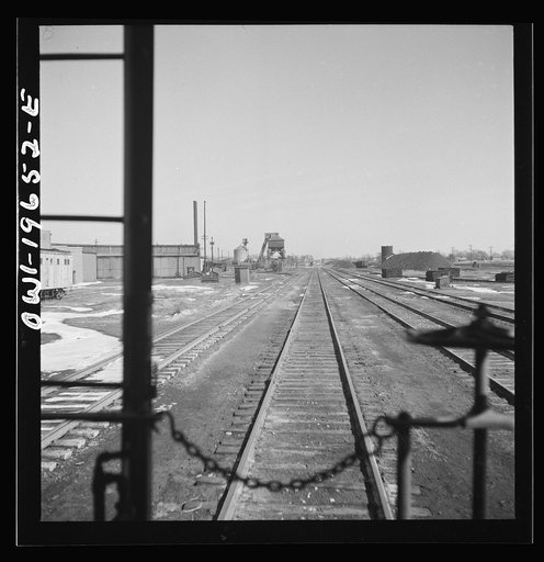 Untitled photo, possibly related to: Marceline, Missouri. A train going through the Atchison, Topeka, and Santa Fe Railroad yard