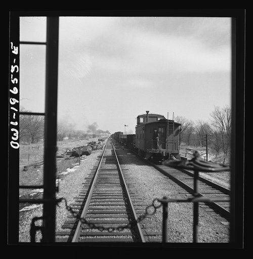 Untitled photo, possibly related to: Marceline, Missouri. A train going through the Atchison, Topeka, and Santa Fe Railroad yard