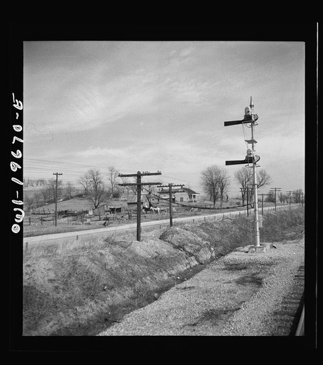 Camden (vicinity), Missouri. A farmstead along the right of way on the Atchison, Topeka, and Santa Fe Railroad between Marceline, Missouri and Argentine, Kansas
