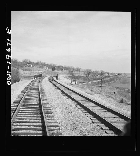 Camden, Missouri. Looking east on the Atchison, Topeka, and Santa Fe Railroad where it crosses over the Wabash Railroad tracks