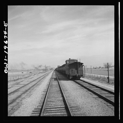 Untitled photo, possibly related to: Sibley, Missouri. A freight train on the Atchison, Topeka, and Santa Fe Railroad between Marceline, Missouri and Argentine, Kansas going across the Missouri river