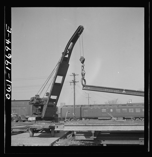 Topeka, Kansas. Breaking rails which have been found defective by the rail doctor car, at the test department of the Atchison, Topeka, and Santa Fe Railroad shops. The rail is dropped so as to crack at the point marked by the chalk marked arrow. The extent of the fissure can then be studied