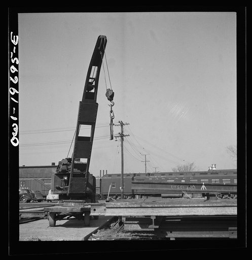 Untitled photo, possibly related to: Topeka, Kansas. Breaking rails which have been found defective by the rail doctor car, at the test department of the Atchison, Topeka, and Santa Fe Railroad shops. The rail is dropped so as to crack at the point marked by the chalk marked arrow. The extent of the