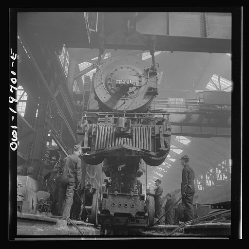 Topeka, Kansas. Wheeling an engine in the Atchison, Topeka, and Santa Fe Railroad locomotive shops