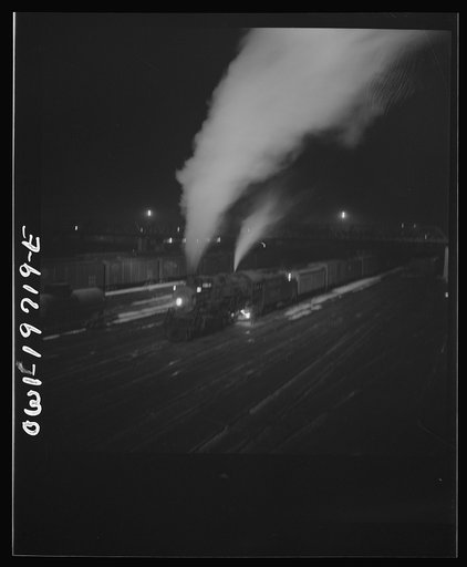 Untitled photo, possibly related to: Argentine, Kansas. Freight train about to leave the Atchison, Topeka, and Santa Fe Railroad yard for the west coast