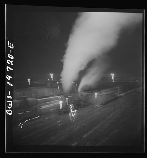 Untitled photo, possibly related to: Argentine, Kansas. Freight train about to leave the Atchison, Topeka, and Santa Fe Railroad yard for the west coast