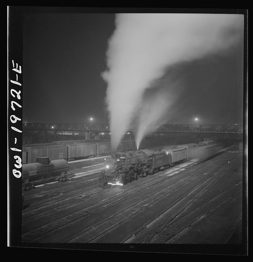 Untitled photo, possibly related to: Argentine, Kansas. Freight train about to leave the Atchison, Topeka, and Santa Fe Railroad yard for the west coast