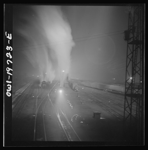 Untitled photo, possibly related to: Argentine, Kansas. Freight train about to leave the Atchison, Topeka, and Santa Fe Railroad yard for the west coast