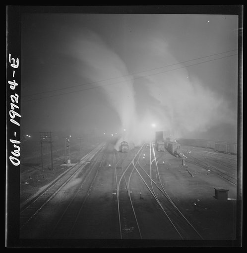 Untitled photo, possibly related to: Argentine, Kansas. Freight train about to leave the Atchison, Topeka, and Santa Fe Railroad yard for the west coast