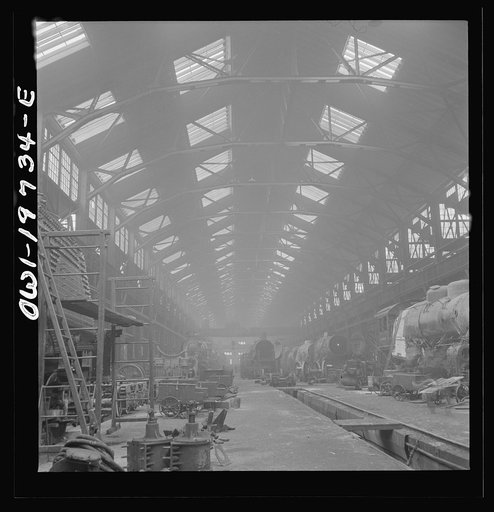 Untitled photo, possibly related to: Topeka, Kansas. A general view of part of the Atchison, Topeka, and Santa Fe Railroad locomotive shops