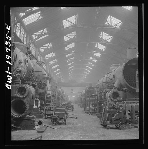 Untitled photo, possibly related to: Topeka, Kansas. A general view of part of the Atchison, Topeka, and Santa Fe Railroad locomotive shops
