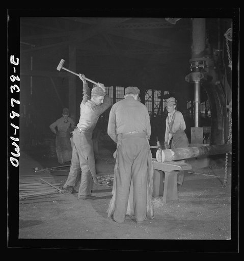 Topeka, Kansas. In the blacksmith shop of the Atchison, Topeka, and Santa Fe Railroad. In addition to the making of the railroad equipment, the blacksmith shop is used for making important repairs to the shop machinery. Here a piston is being hammered out for a drop hammer in another part of the bui