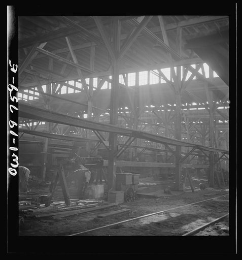 Untitled photo, possibly related to: Topeka, Kansas. In the shops of the Atchison, Topeka and Santa Fe Railroad, cars are completely stripped and rebuilt from the ground up