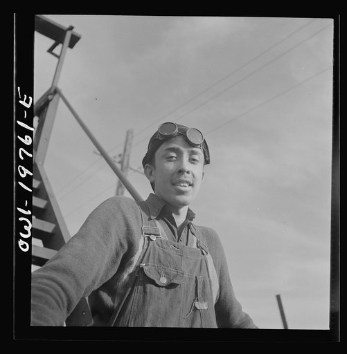 Topeka, Kansas. Eladio Tostato, steel car repairer's helper and rivet heater, at the car shops of the Atchison, Topeka and Santa Fe Railroad
