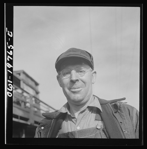 Topeka, Kansas. Walter Mitchell, steel car repairer and riveter, at the car shops of the Atchison, Topeka and Santa Fe Railroad