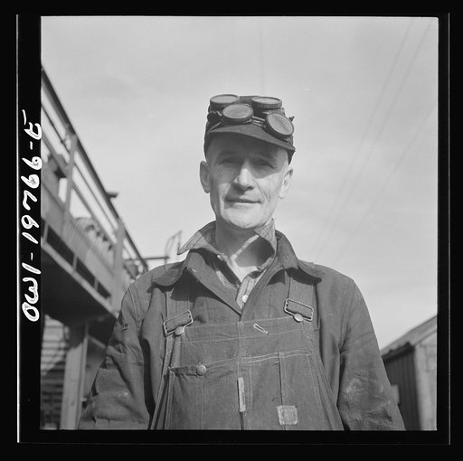 Topeka, Kansas. Claude Sweangen, steel car repairer, at the car shops of the Atchison, Topeka and Santa Fe Railroad