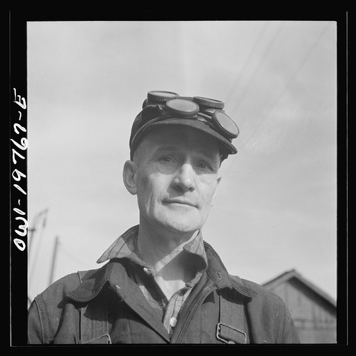Untitled photo, possibly related to: Topeka, Kansas. Claude Sweangen, steel car repairer, at the car shops of the Atchison, Topeka and Santa Fe Railroad