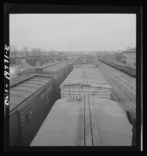 Argentine, Kansas. Westbound Atchison, Topeka and Santa Fe freight pulling out of the railroad yard between Argentine and Emporia, Kansas