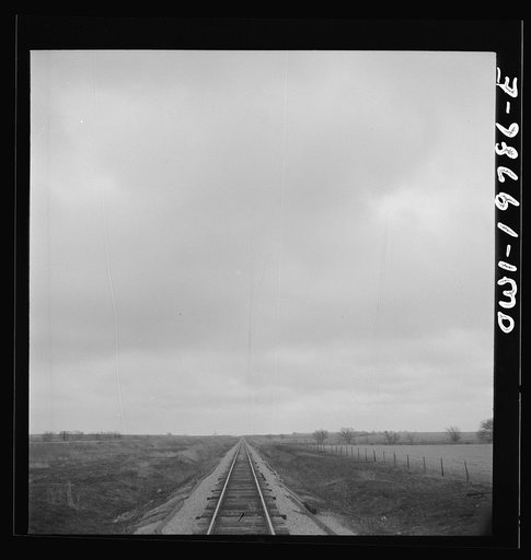 Leloup, Kansas. Crossing farmland between Argentine and Emporia, Kansas on the Atchison, Topeka, and Santa Fe Railroad