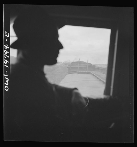 Untitled photo, possibly related to: Emporia, Kansas. Crossing farm land along the Atchison, Topeka, and Santa Fe Railroad between Argentine and Emporia, Kansas