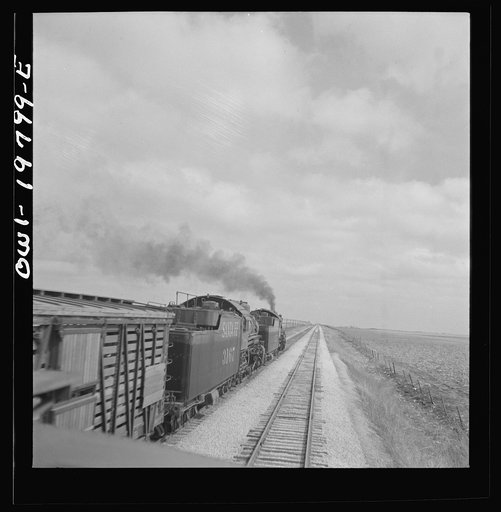 Emporia, Kansas. An Atchison, Topeka, and Santa Fe train between Argentine and Emporia, Kansas passing an eastbound freight train
