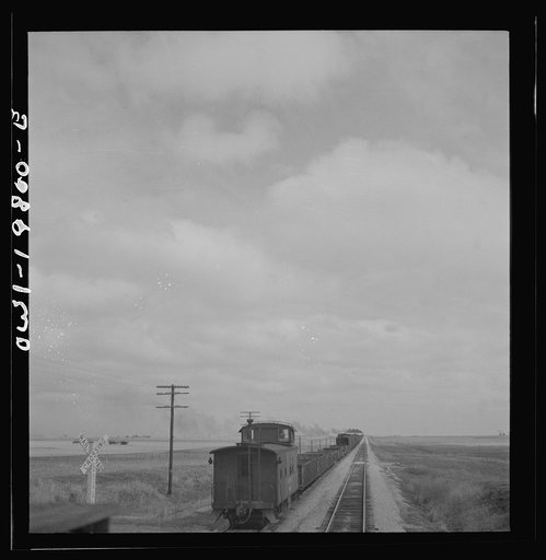 Emporia, Kansas. An Atchison, Topeka, and Santa Fe train between Argentine and Emporia, Kansas passing an eastbound freight train