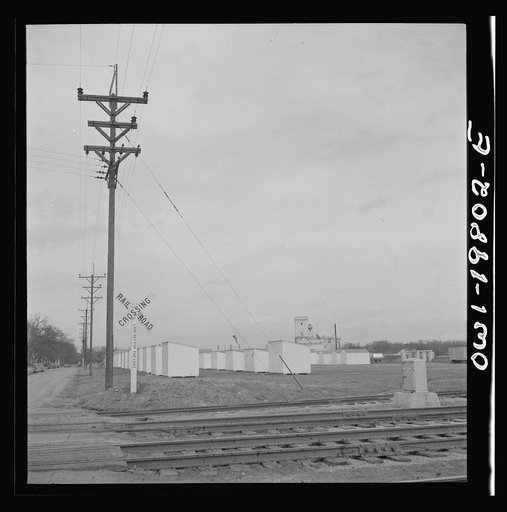 Untitled photo, possibly related to: Emporia (vicinity), Kansas. Crossing farm land along the Atchison, Topeka, and Santa Fe Railroad