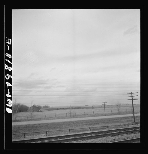 Untitled photo, possibly related to: An Atchison, Topeka, and Santa Fe passenger train passing through the Flint Hills district of Kansas. This is a famous stock feeding area