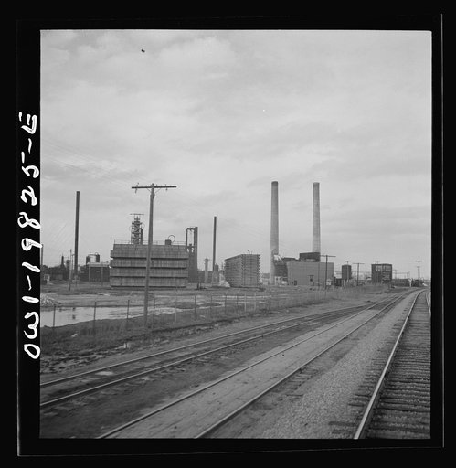 Wellington, Kansas. Passing an oil refinery on the Atchison, Topeka, and Santa Fe Railroad between Emporia and Wellington, Kansas