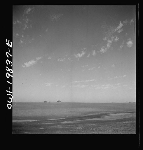 Argonis, Kansas. Crossing wheat fields along the Atchison, Topeka, and Santa Fe Railroad between Wellington, Kansas and Waynoka, Oklahoma