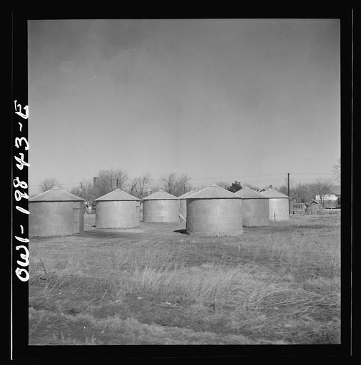 Argonis, Kansas. Wheat storage bins on the Atchison, Topeka and Santa Fe Railroad between Wellington, Kansas and Waynoka, Oklahoma
