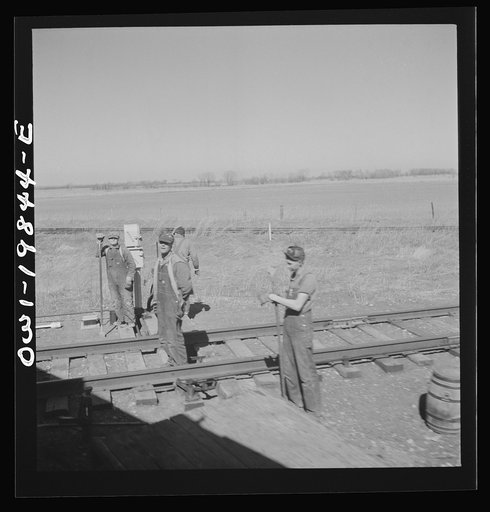 Untitled photo, possibly related to: Carrollton (vicinity), Missouri. A section gang at work along the Atchison, Topeka, and Santa Fe Railroad between Marceline, Missouri and Argentine, Kansas