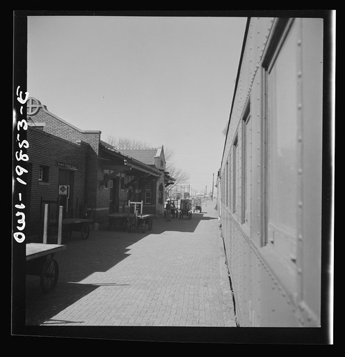 Untitled photo, possibly related to: Kiowa, Kansas. Train waiting for a block signal along the Atchison, Topeka and Santa Fe Railroad between Wellington, Kansas and Waynoka, Oklahoma