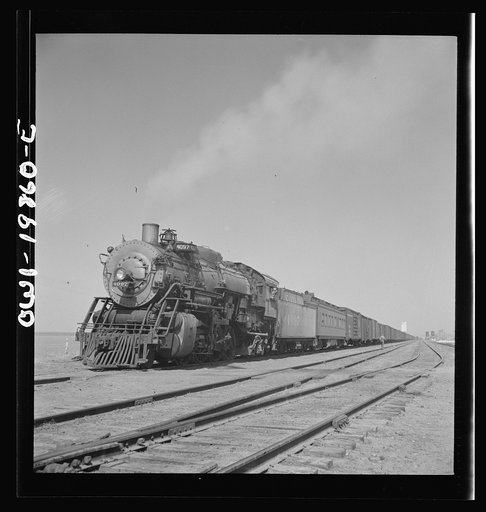 Untitled photo, possibly related to: Kiowa, Kansas. Freight train pulling out on the Atchison, Topeka and Santa Fe Railroad between Wellington, Kansas and Waynoka, Oklahoma