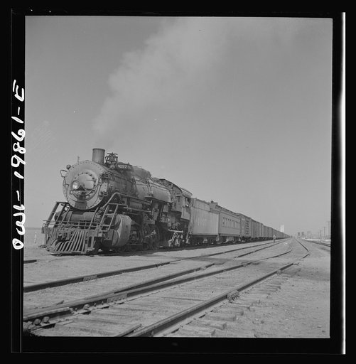 Untitled photo, possibly related to: Kiowa, Kansas. Freight train pulling out on the Atchison, Topeka and Santa Fe Railroad between Wellington, Kansas and Waynoka, Oklahoma