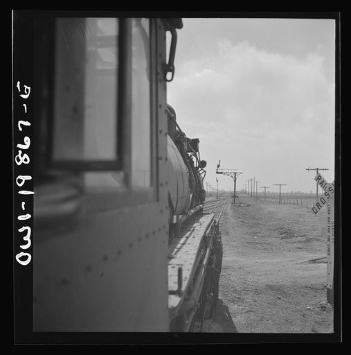 Untitled photo, possibly related to: Kiowa (vicinity), Kansas. Train waiting for a block signal along the Atchison, Topeka, and Santa Fe Railroad