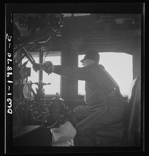 Kiowa, Kansas. Engineer B. F. Hale in the cab of his engine on the Atchison, Topeka, and Santa Fe Railroad between Wellington, Kansas and Waynoka, Oklahoma