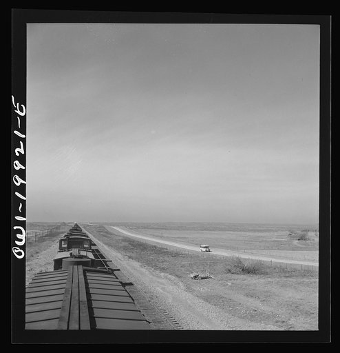 Higgins, Texas. Going across flat lands along the Atchison, Topeka and Santa Fe Railroad