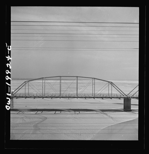Crossing the almost-dry river bed of the Canadian River along the Atchison, Topeka and Santa Fe Railroad