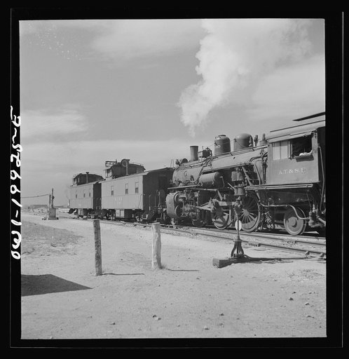Canadian, Texas. Switch engine changing cabooses on a Atchison, Topeka and Santa Fe Railroad train